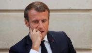 French President Emmanuel Macron reacts as he inaugurates the Commission on the first 1000 days of the child in Paris, France September 19, 2019. AFP/Philippe Wojazer