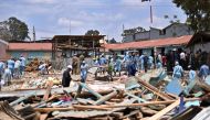 Rescuers are at work around a collapsed school building, on September 23, 2019 in Nairobi. AFP / TONY KARUMBA