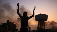 An Iraqi protester chants slogans during a demonstration against state corruption, failing public services and unemployment at Tayaran square in Baghdad on October 2, 2019.   AFP / AHMAD AL-RUBAYE