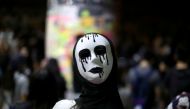 An anti-government protester wears a mask during a demonstration in Wong Tai Sin district, in Hong Kong, China October 4, 2019. Reuters/Athit Perawongmetha