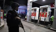 Police Mobile Brigade  stands guard at a gas station in Jayapura, Papua, August 31, 2019. (Zabur Karuru / Antara Foto via Reuters) 