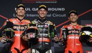 Ducati’s Chaz Davies (left), Rea (centre) and Bautista pose for a photo on the podium. 