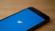 (FILES) In this file photo taken on July 10, 2019, the Twitter logo is seen on a phone in this photo illustration in Washington, DC. AFP / Alastair Pike