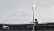 A volunteer is seen as the Twenty20 cricket match between Australia and Pakistan is halted due to rain at the Sydney Cricket Ground in Sydney on November 3, 2019. AFP / AFP / Saeed Khan 