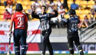 New Zealand's Mitchell Santner (C) celebrates taking the wicket of England's Chris Jordan during the Twenty20 cricket match between New Zealand and England at Westpac Stadium in Wellington on November 3, 2019. AFP | Marty MELVILLE
