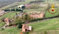 This aerial photo was taken and handout on November 5, 2019, by the Italian National Firefighters Corps (Vigili del Fuoco) shows the debris of an inhabited building that exploded overnight in Quargnento, in the northern Piedmont region. AFP PHOTO / VIGILI