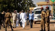 Cherif Sy, Burkina Faso's Defense Minister (C,L) and Florence Parly, France's Defense Minister (C,R) review the troops during a visit at the Burkinabe minister of Defense in Ouagadougou, on Novembrer 4, 2019. AFP / Olympia De Maismont
 