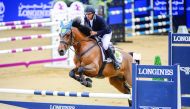 Achraf Oualla guiding Dino BB Z over an obstacle in the Medium Tour competition.