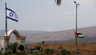 The national flags of Jordan and Israel are seen from the Israeli side of the border area between Israel and Jordan, in Naharayim October 29, 2019. Reuters/Ronen Zvulun
 