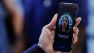 A woman sets up her facial recognition as she looks at her Apple iPhone X at an Apple store in New York, November 3, 2017. Reuters / Lucas Jackson