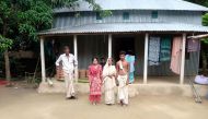 A view of the widow of Mongol Chandra Sarker (in white sari) with her daughter and son in front of the family's tin house in central Bangladesh's Ghior sub-district, September 1, 2019. Thomson Reuters Foundation/A.Z.M. Anas