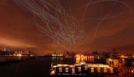 LED lights attached to pigeons leave light trails in the sky while they fly as part of the Fly By Night art installation by Duke Riley above the Brooklyn borough of New York, May 5, 2016. Reuters / Lucas Jackson