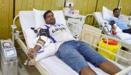 An employee of Galfar during the blood donation campaign.