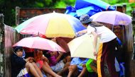 Youngsters sit in a truck after the local government implemented preemptive evacuations at Barangay Matnog Daraga Albay province on December 25, 2016 due to the approaching typhoon Nock-Ten (AFP) 