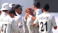 New Zealand's Neil Wagner (C) celebrates with teammates after dismissing England's Stuart Broad to win the Test match during the fifth day of the first cricket test between England and New Zealand at Bay Oval in Mount Maunganui on November 25, 2019. AFP /