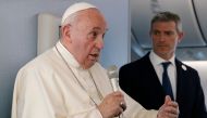 Pope Francis speaks to reporters during a news conference onboard the papal plane on his flight back from a week-long trip to Thailand and Japan, on November 26, 2019. AFP / Remo Casilli 