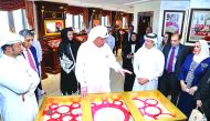 Hussain Al Fardan (centre), Board Member and  Vice-Chairman of Commercial Bank, narrating the story behind the rare jewellery collections to Commercial Bank’s valued customers at the gallery.