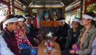 The family of Vo Van Linh transport his coffin bearing his remains on a funeral van for cremation in Can Loc district, Ha Tinh province on November 28, 2019. The first remains of the 39 people found dead in a truck in Britain last month arrived in Vietnam