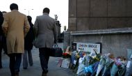 Commuters walk past the scene of a fatal attack on London Bridge in London, Britain December 2, 2019. REUTERS/Henry Nicholls
