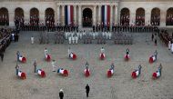 France's President Emmanuel Macron stands in front of coffins of the 13 French soldiers killed in Mali during a tribute ceremony on December 2, 2019 at the Invalides monument, in Paris. AFP /  Eliot Blondet
 