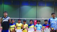 The players of New Vision Badminton Sport (NVBS) pose for a picture with coaches during the  2nd Qatar Oruma Open Badminton Championship 2019 at Ali Bin Hamad Al Attiyah Arena.