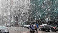 People cross a street amid a snow flurry in central Kiev, Ukraine, March 27, 2019. Reuters / Gleb Garanich