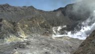 An aeriel view shows hikers walking on the crater rim of Whakaari, also known as White Island, shortly before the volcano erupted in New Zealand, December 9, 2019, in this image obtained via social media. GNS Science via REUTERS 