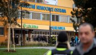Police officers stand guard near the site of a shooting in front of a hospital in Ostrava, Czech Republic, December 10, 2019. REUTERS/Lukas Kabon