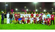 QSL coaches and officials pose for a group photo.