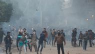 Protesters throw stones towards police during a protest against the Citizenship Amendment Bill outside the Jamia Millia Islamia University in New Delhi, India, December 13, 2019. Reuters/Adnan Abidi
 