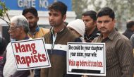 Demonstrators hold placards to protest against the Hyderabad rape and murder of a 27-year-old veterinary doctor during a demonstration in New Delhi on December 6, 2019. AFP / Prakash Singh