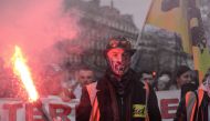 Protesters march during a demonstration in Paris on December 19, 2019, on the 15th day of a nationwide multi-sector strike against the French government's pensions overhaul. (AFP / Aurore MESENGE)