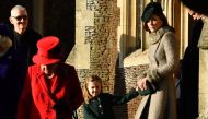 (L-R) Britain's Queen Elizabeth II, Britain's Princess Charlotte of Cambridge and Britain's Catherine, Duchess of Cambridge leave after the Royal Family's traditional Christmas Day service at St Mary Magdalene Church in Sandringham, Norfolk, eastern Engla