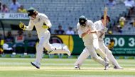 Australia's wicketkeeper Tim Paine (L) celebrates stumping New Zealand batsman Henry Nicholls (R) on the fourth day of the second cricket Test match at the MCG in Melbourne on December 29, 2019. / AFP / WILLIAM WEST / 