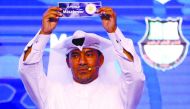 An official picks Mesaimeer during the official draw held yesterday.