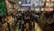 Commuters descend the stairs to catch the tube at Oxford Circus Station in central London on November 24, 2017, following an incident. AFP / Daniel Leal-Olivas