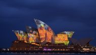 The sails of the Opera House are lit with a series of images to show support for the communities affected by the bushfires and to express the gratitude to the emergency services and volunteers in Sydney on January 11, 2020. Massive bushfires in southeaste
