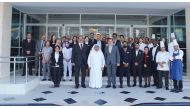 Sheikh Faisal bin Qassim Al Thani (centre), Chairman, ARTIC and DoubleTree by Hilton Doha - Al Sadd  team posing for a group picture during the opening ceremony.