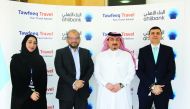 The officials of Ahlibank and Tawfeeq Travel during the event.