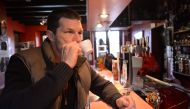  British' Mark Lawrence, 48 years old, working as carpenter, drinks a coffee in a cafe in Plazac village (Dordogne), on January 23, 2020. (AFP / MEHDI FEDOUACH)
