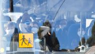 A vehicle believed to contain French citizens after their evacuation from the Chinese city of Wuhan, arrives at The Vacanciel Holiday Resort in Carry-le-Rouet, near Marseille, southern France on January 31, 2020, following their repatriation from the coro