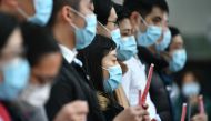 Local medical workers hold a strike near Queen Mary Hospital as they demand the city close its border with China to reduce the coronavirus spreading, in Hong Kong on February 3, 2020.