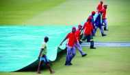 Groundsman at the Kingsmead Cricket Ground covering the pitch area during the South Africa vs England, second ODI, yesterday.