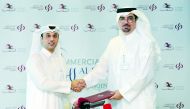 Hussein Ali Al Abdulla, (right) EGM and Chief Marketing Officer, Commercial Bank,  and  Omar Al Mannai, Commercial Manager Al Shaqab and Event Director CHI Al Shaqab, pose for a picture after the signing ceremony. Pic: Abdul Basit/The Peninsula