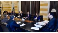  shows Prime Minister Hassan Diab  meeting with a delegation from the International Monetary Fund (IMF) at the Grand Serail in Beirut on February 19, 2020 .(AFP PHOTO / DALATI AND NOHRA)