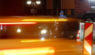 A Swiss border guard checks a car at the Swiss-Italian border in Ponte Tresa, Switzerland February 24, 2020. Reuters/Arnd Wiegmann
 