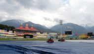 Ground staff work on the pitch ahead of the start of first one day international (ODI) cricket match of a three match series between India and South Africa, at the Himachal Pradesh Cricket Association Stadium in Dharamsala on March 12, 2020. 
/ AFP / Saj