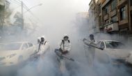 TEHRAN, IRAN - MARCH 19: Fire brigade crews wearing protective masks carry out disinfection works due to the coronavirus (COVID-19) outbreak, on March 19, 2020 in Tehran, Iran. The death toll in Iran from the coronavirus outbreak rose to 1284. ( Fatemeh B