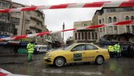 Greater Amman Municipality employees sanitize cars at street amid concerns over the coronavirus disease (COVID-19) spread, outside al Husseini mosque in downtown Amman, Jordan, March 20, 2020. Reuters/Muhammad Hamed