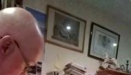 Vicar Stephen Beach of St Budeaux parish church reacts as his sweater catches fire while delivering a video sermon, amid the coronavirus disease (COVID-19) outbreak, in Plymouth, Britain, March 19, 2020, in this still image from video obtained via social 